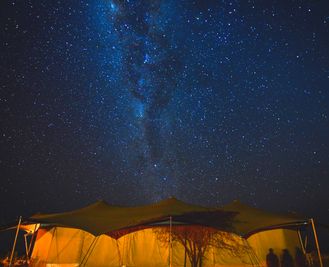 The Milky Way shines above the dining tent